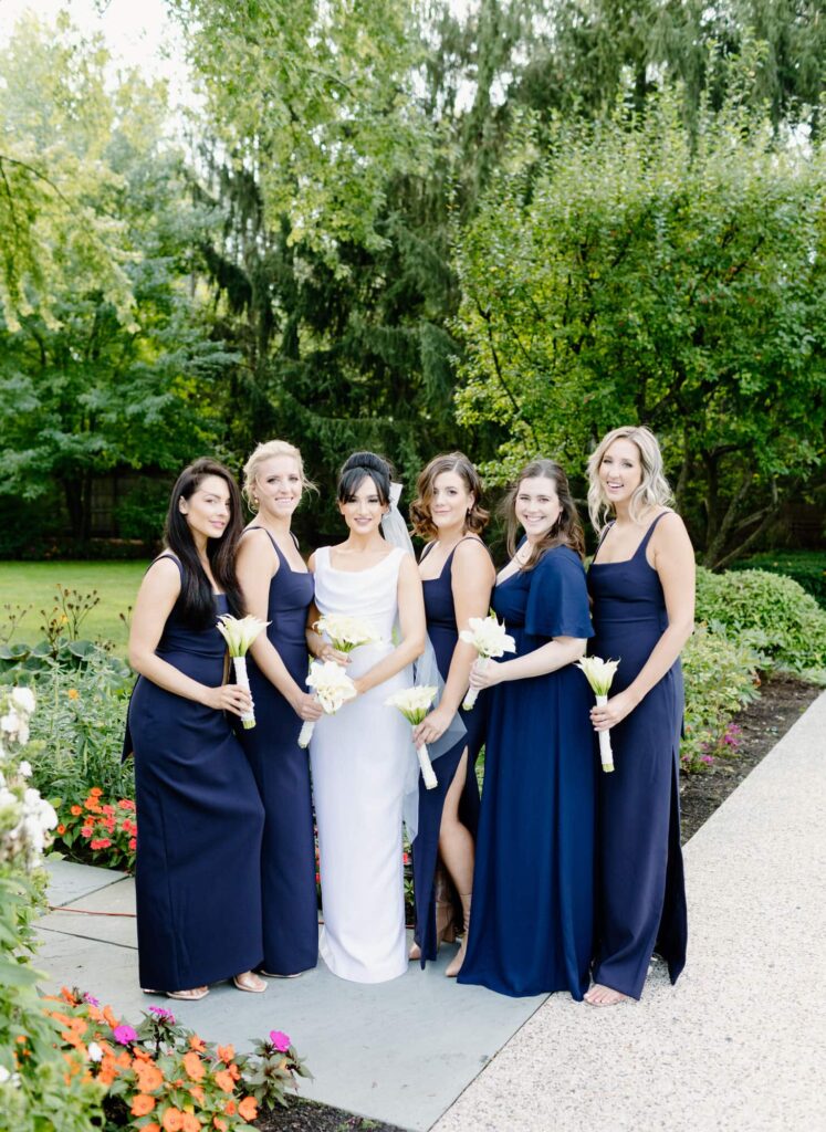Bride and bridal party in beautiful navy blue dresses