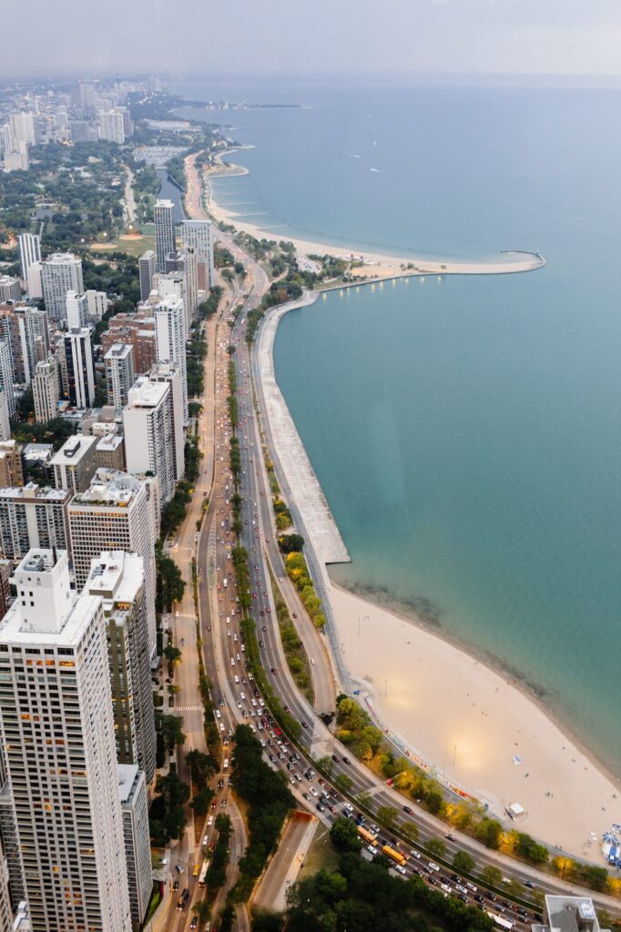 A Chicago city skyline view with beachfront from the Signature Room at the 95th