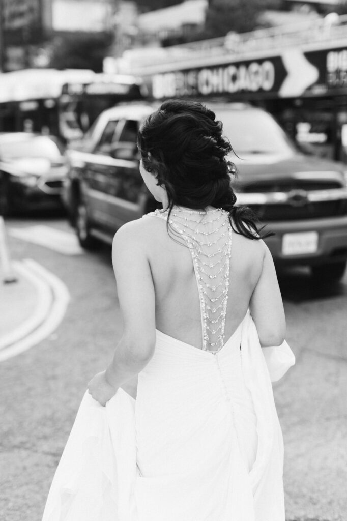 bride walking down a Chicago city street close to the Signature Room