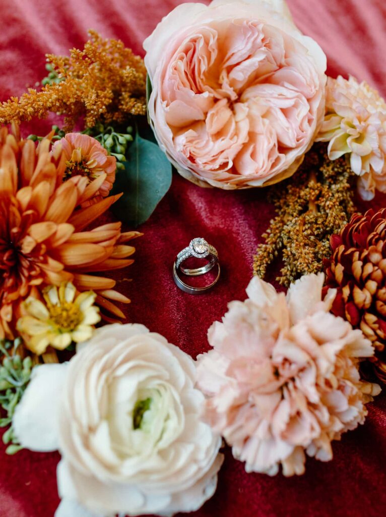 flat lay detail of florals and rings