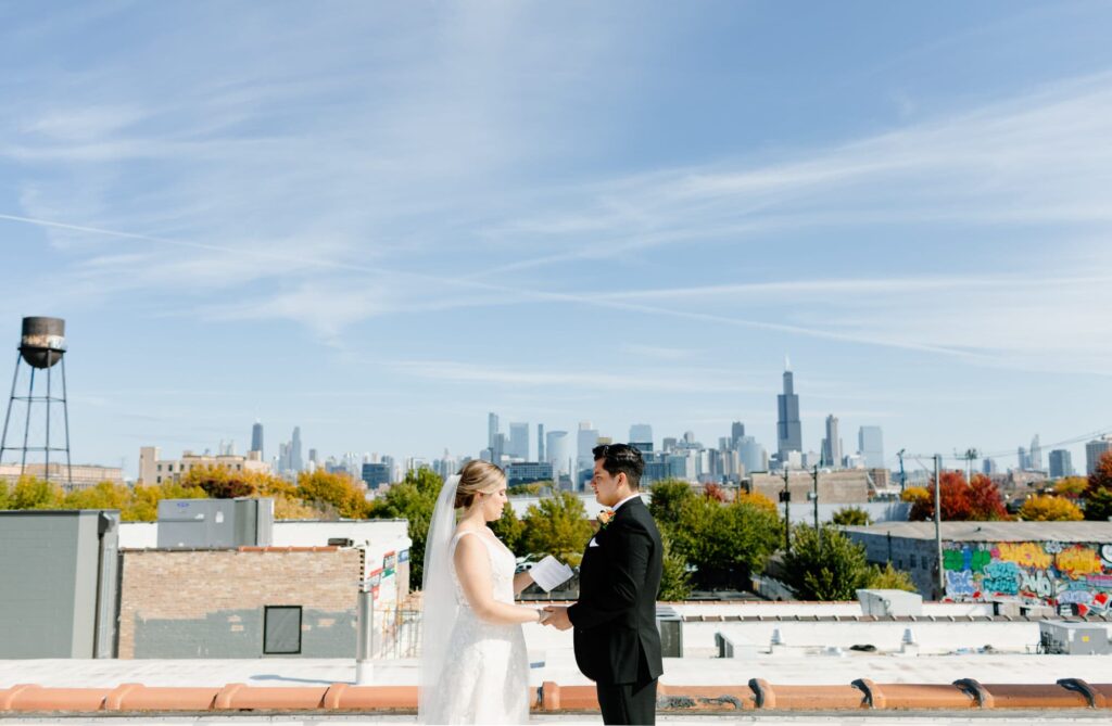 Bride and Groom read vows on the rooftop at the Walden in Chicago