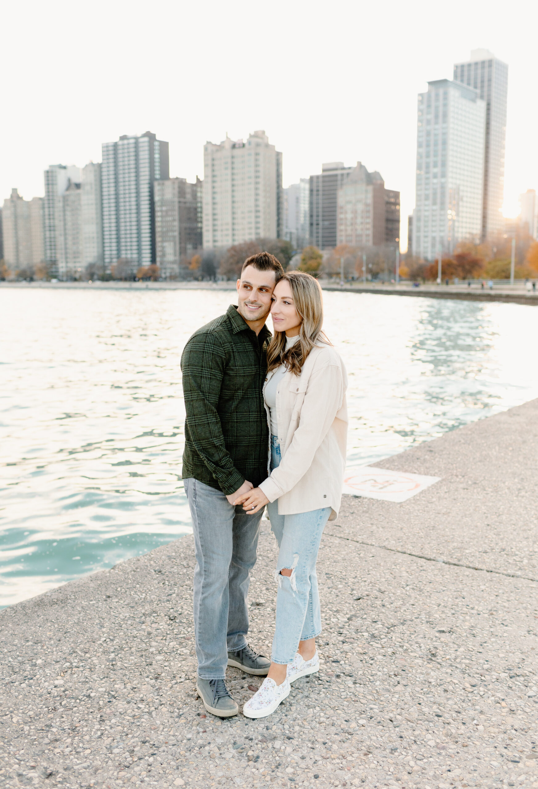 A couple during at North Avenue beach during their Engagement session in Chicago