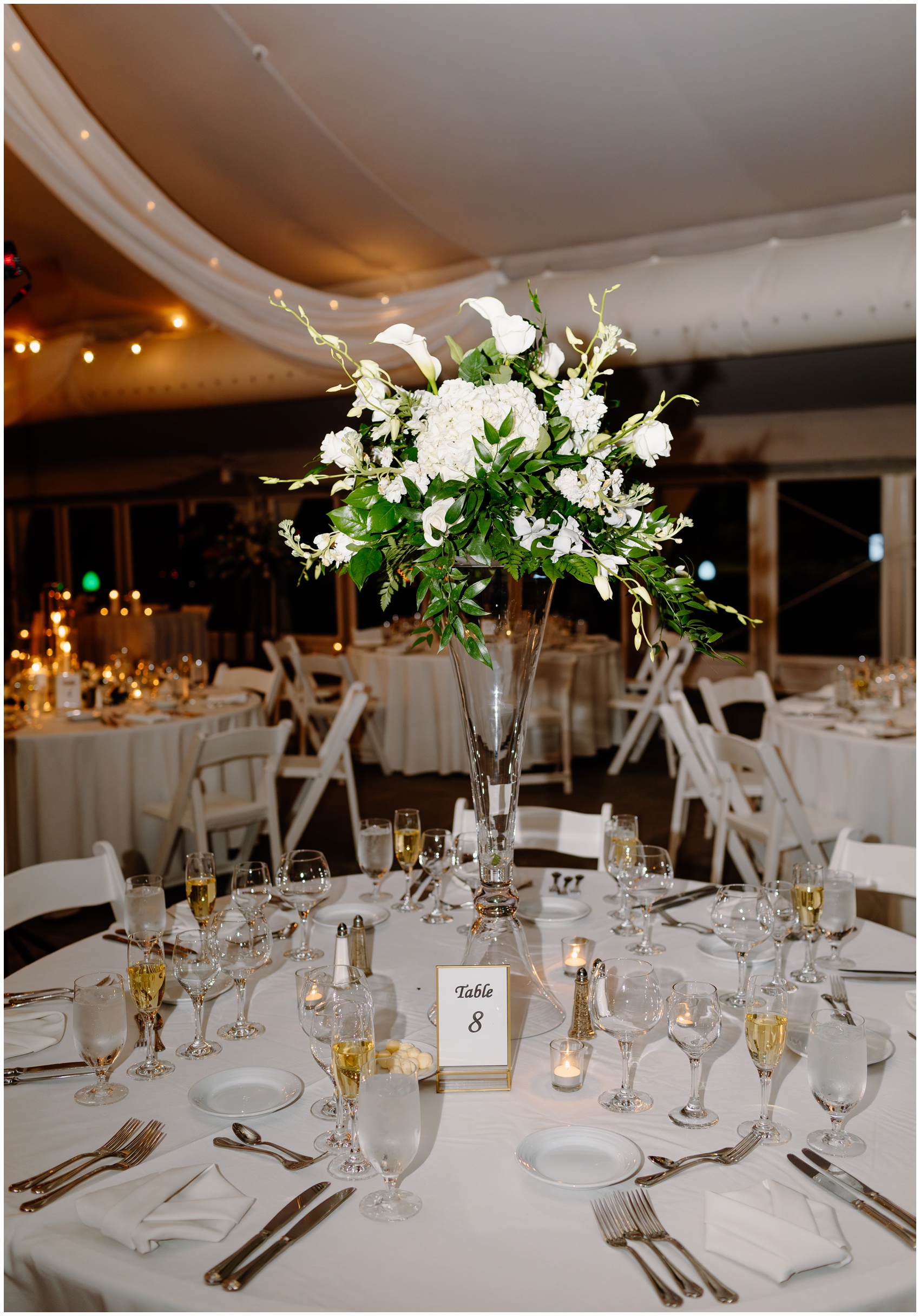 Details of a tall white flower centerpiece for a wedding reception