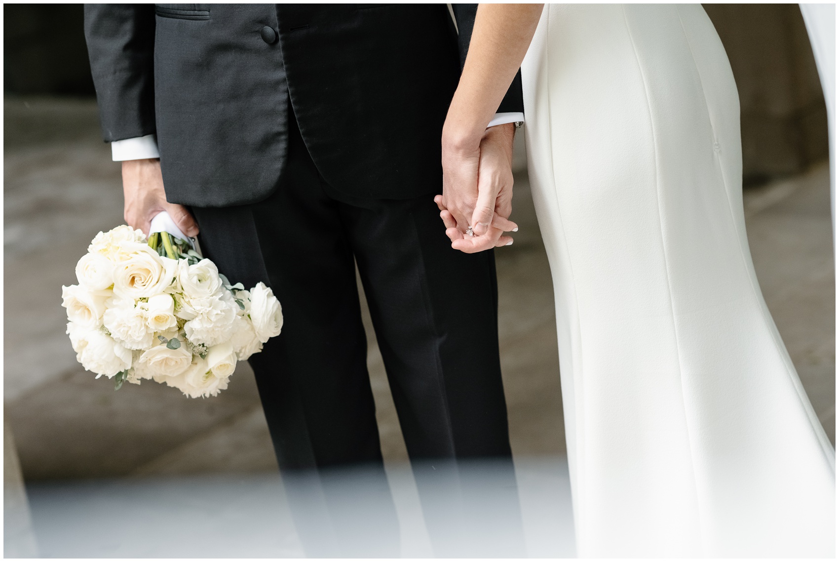 Details of newlyweds holding hands