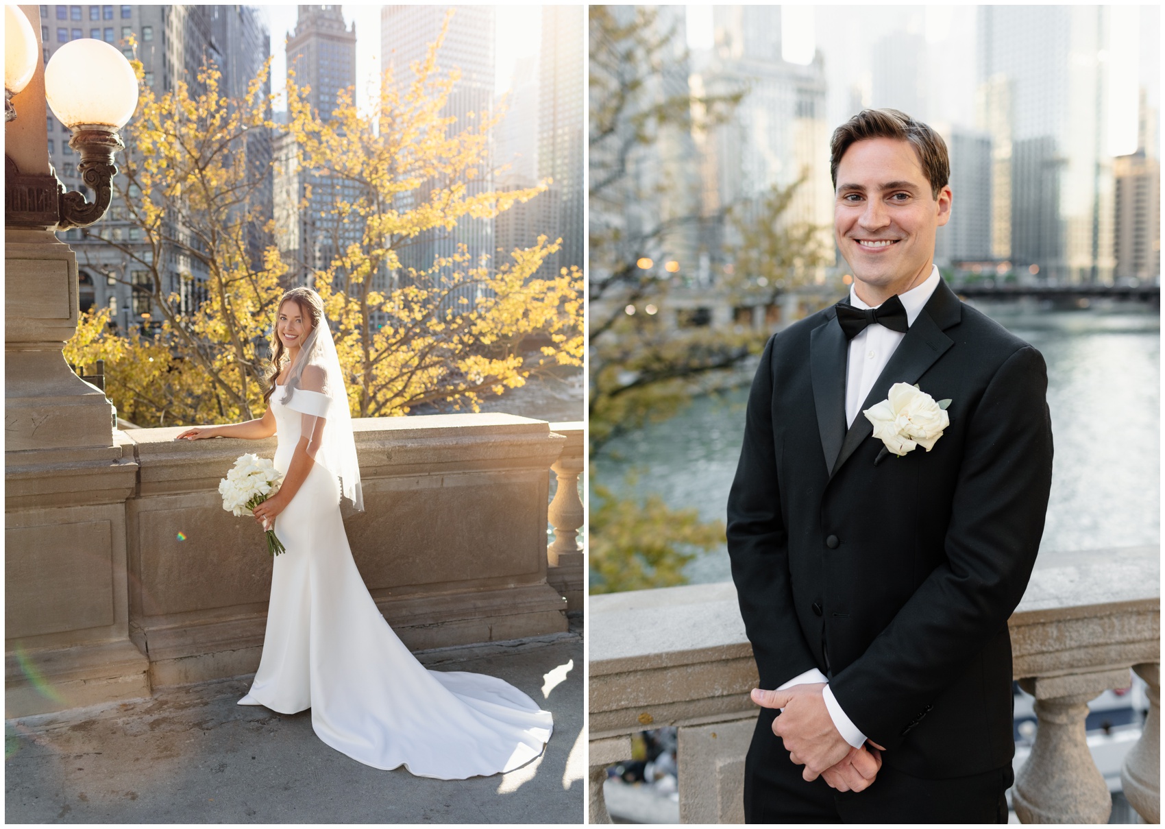 A bride and groom smile while standing on a stone bridge at sunset over the river