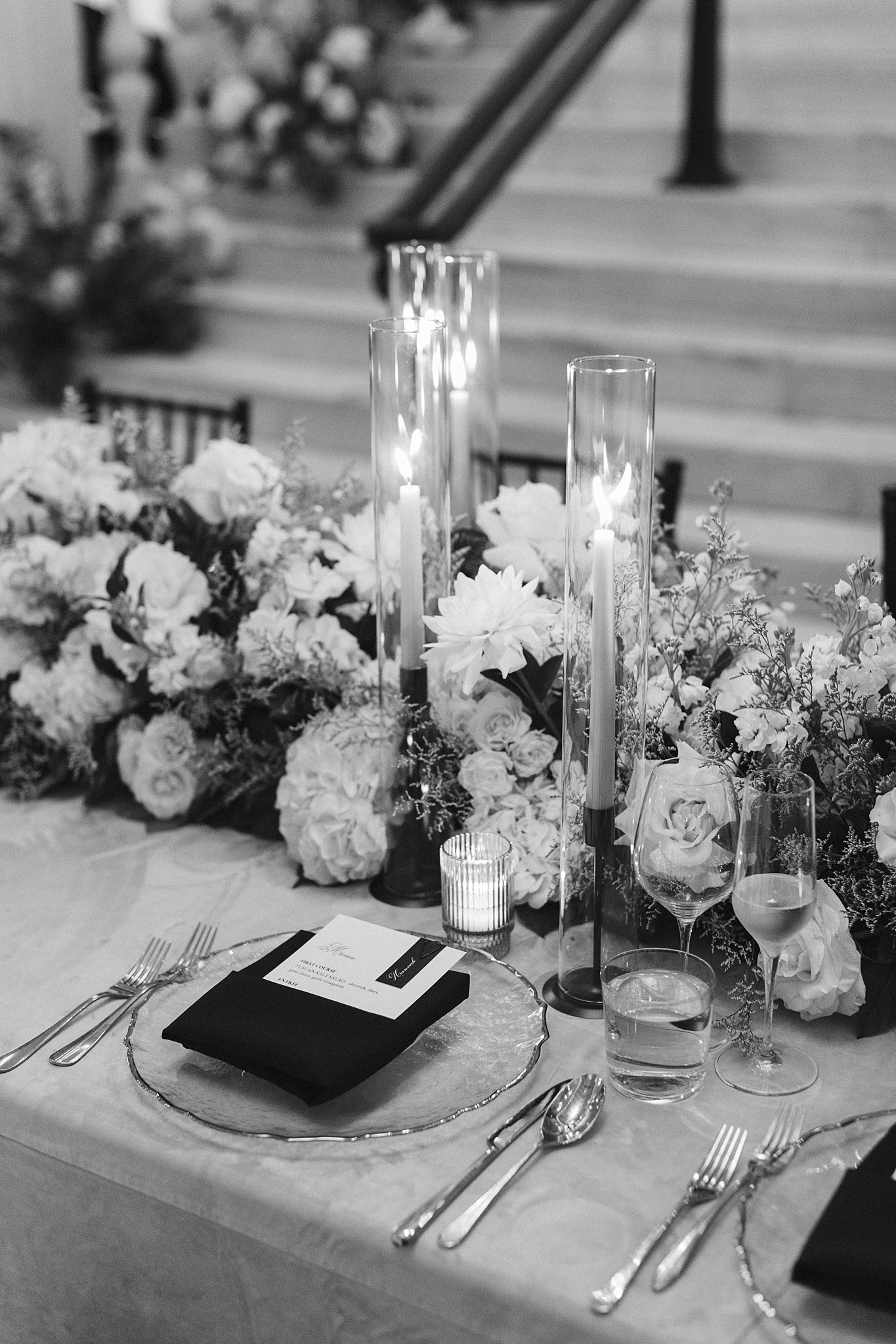 Details of a wedding reception place setting in black and white