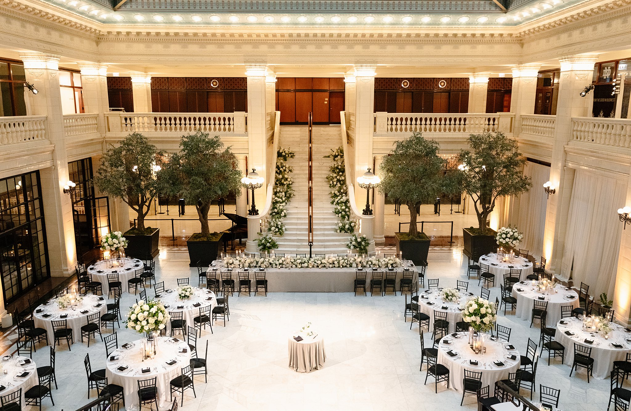 A peak down into the ballroom of one of the Downtown Chicago Wedding Venues set up with tables and flowers everywhere