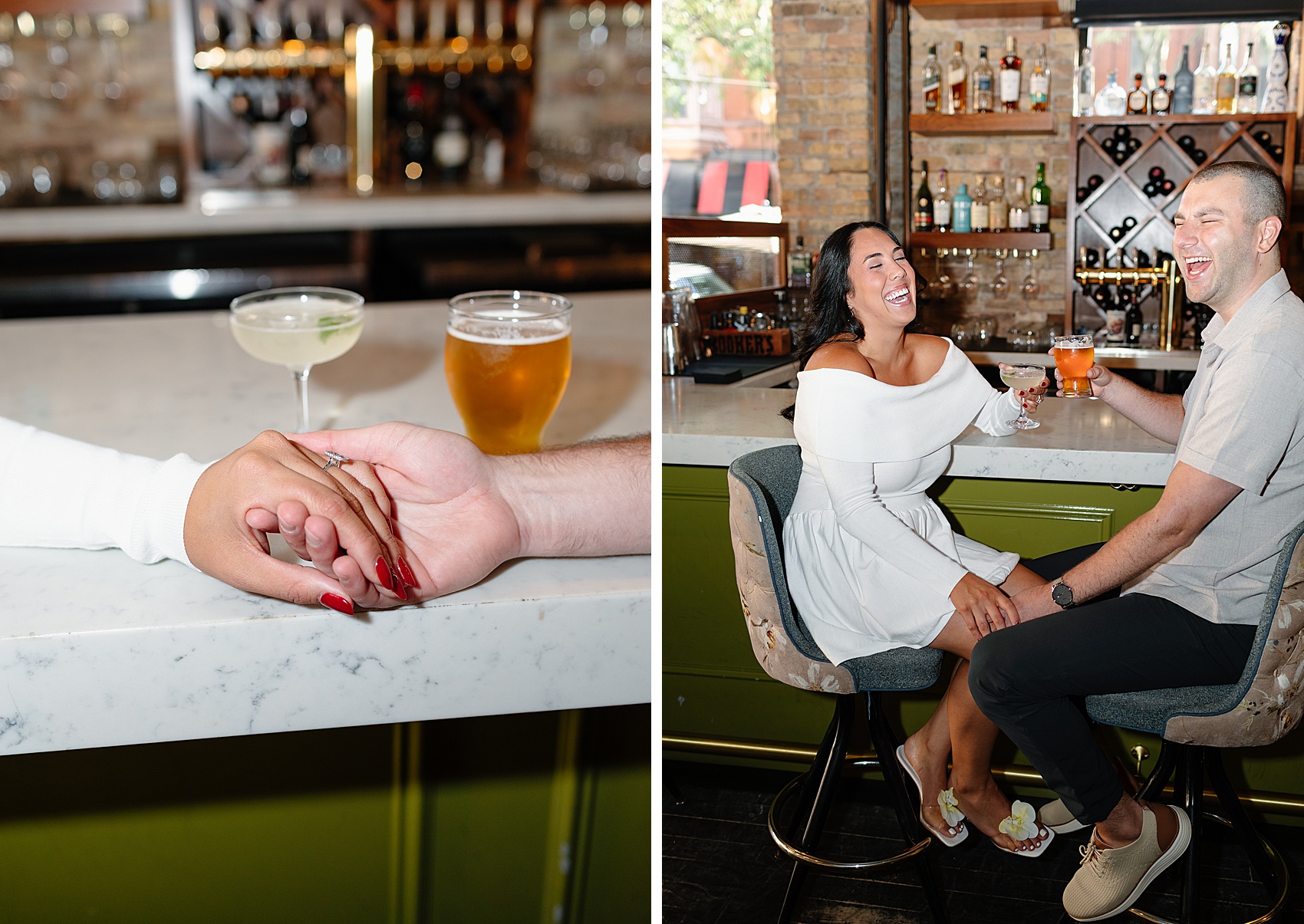 A laughing engaged couple sip drinks at a bar next to their hands holding each other with drinks on the bar